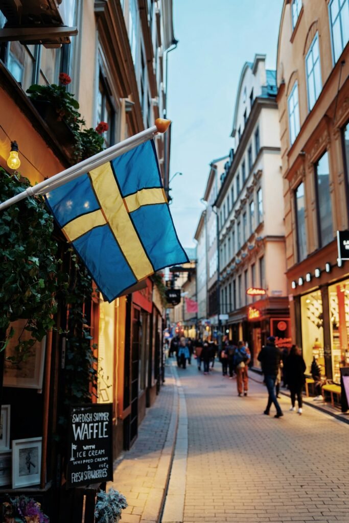 Swedish flags hanging over a street in Stockholm's old town