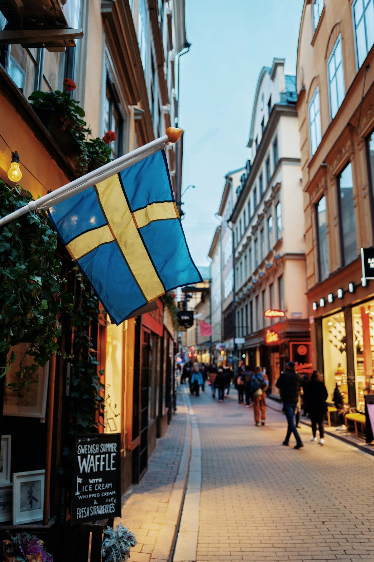 Swedish flags hanging over a street in Stockholm's old town